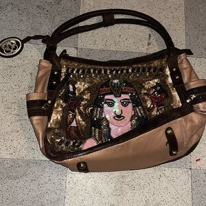 Sharif New York. Bronze and gold beaded main colors with red,peach and blue trim